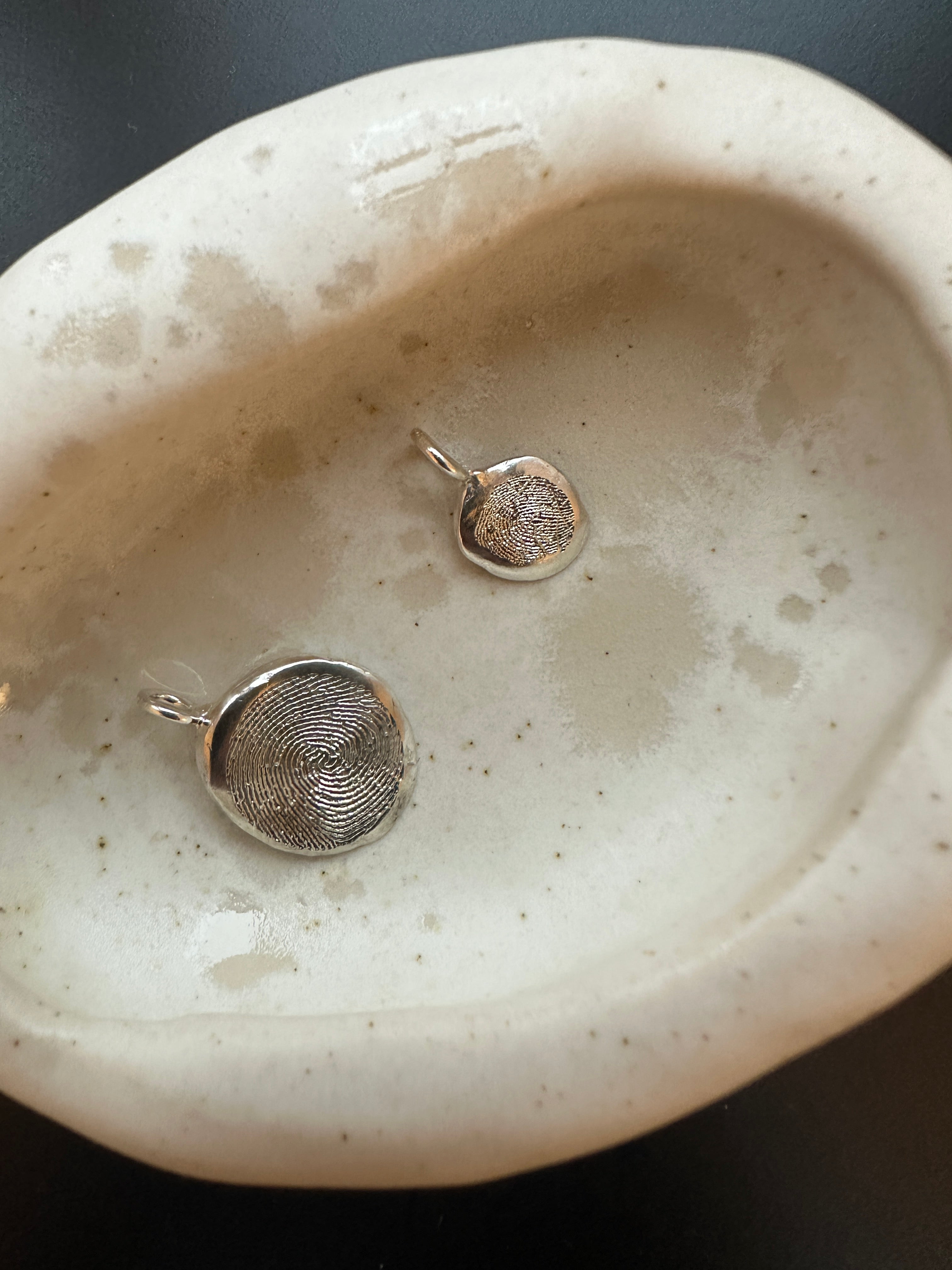 Engraved fingerprint pendants